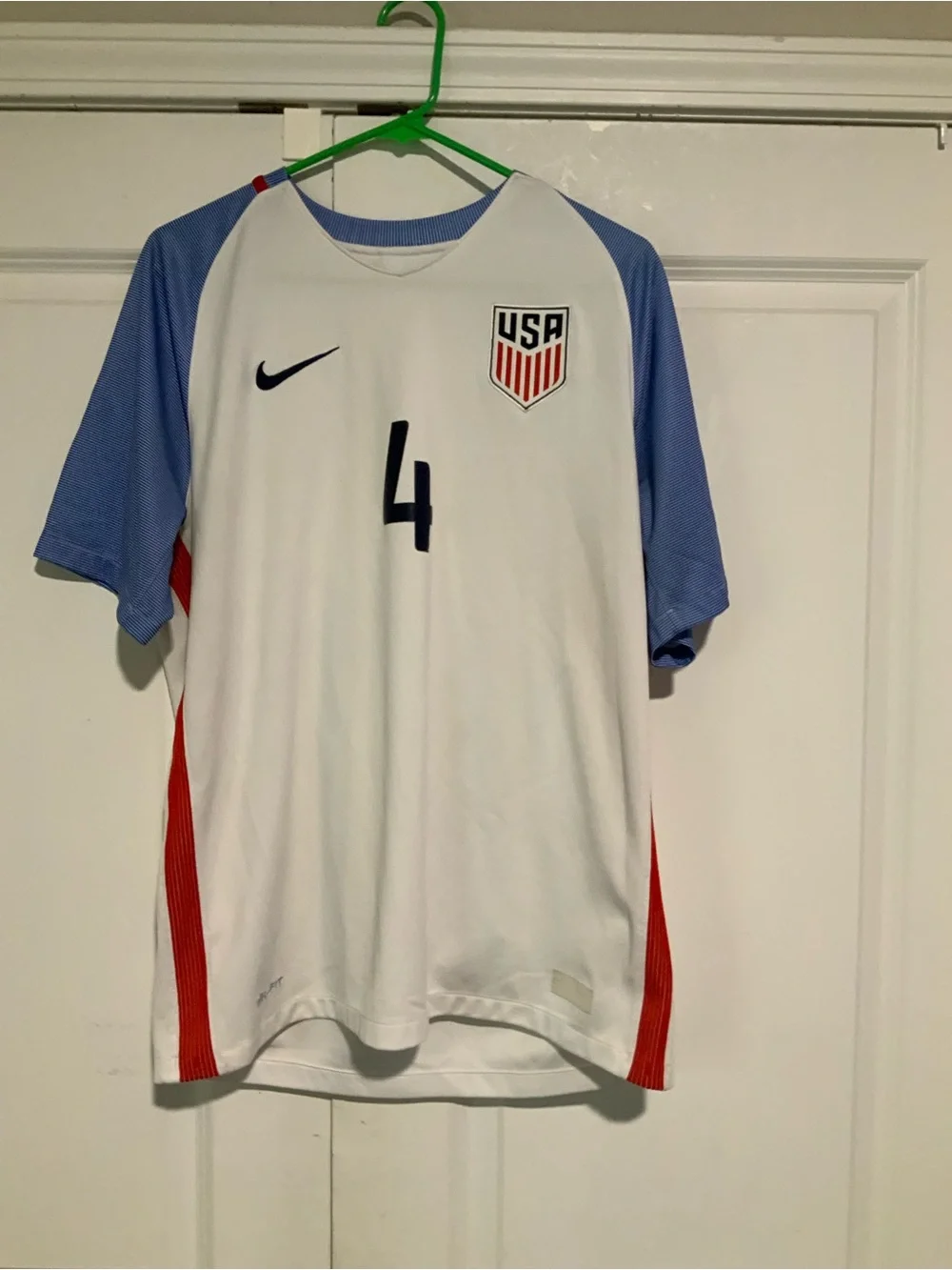 Nike Kids White Soccer Jersey with Blue Sleeves and Red Accents
